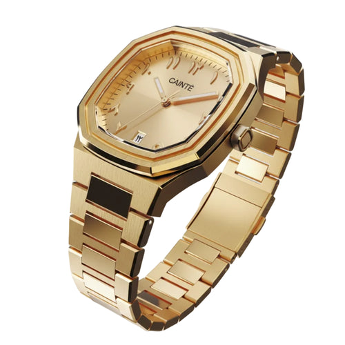 Gold wristwatch with 'CAINTE' branding on a white background